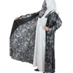 Marble Peacock black & white marble print with a white satin underlay abaya front three-quarter view with marble-print open coat over a white satin slip