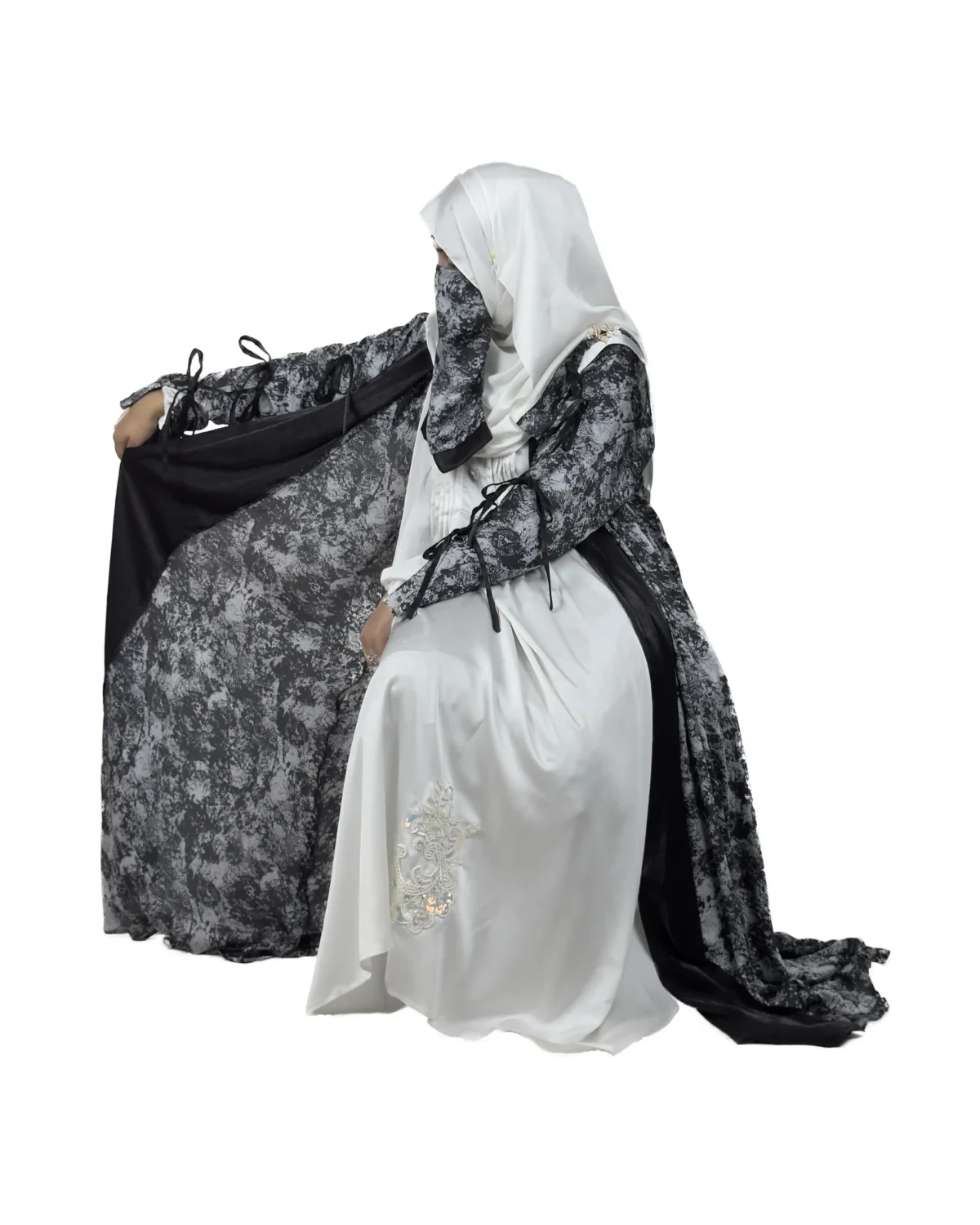 Marble Peacock black & white marble print with a white satin underlay abaya front three-quarter view with marble-print open coat over a white satin slip