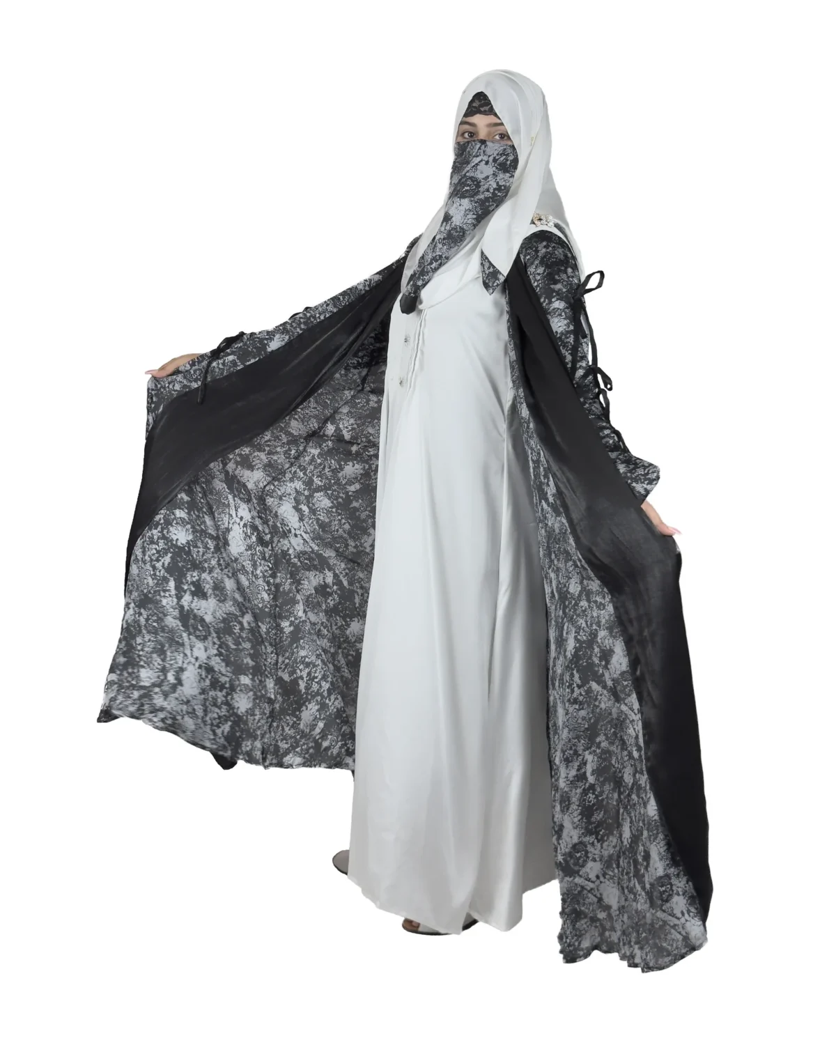 Marble Peacock black & white marble print with a white satin underlay abaya front three-quarter view with marble-print open coat over a white satin slip
