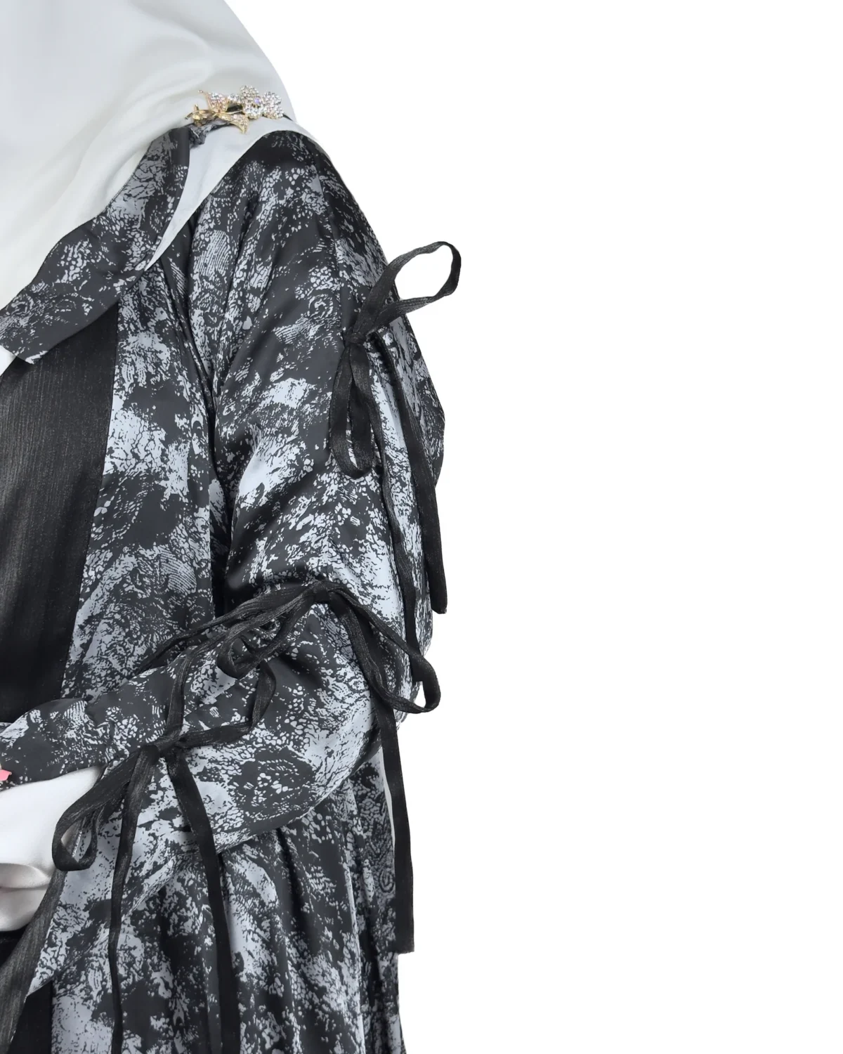 Marble Peacock black & white marble print with a white satin underlay abaya close-up of the tie-fastened sleeve cuff