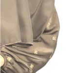 Mocha Starlight mocha / warm dark brown abaya close-up of the hand-embroidered cream-gold star flowers