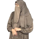 Mocha Starlight mocha / warm dark brown abaya front three-quarter view with hand-embroidered cream-gold star flowers