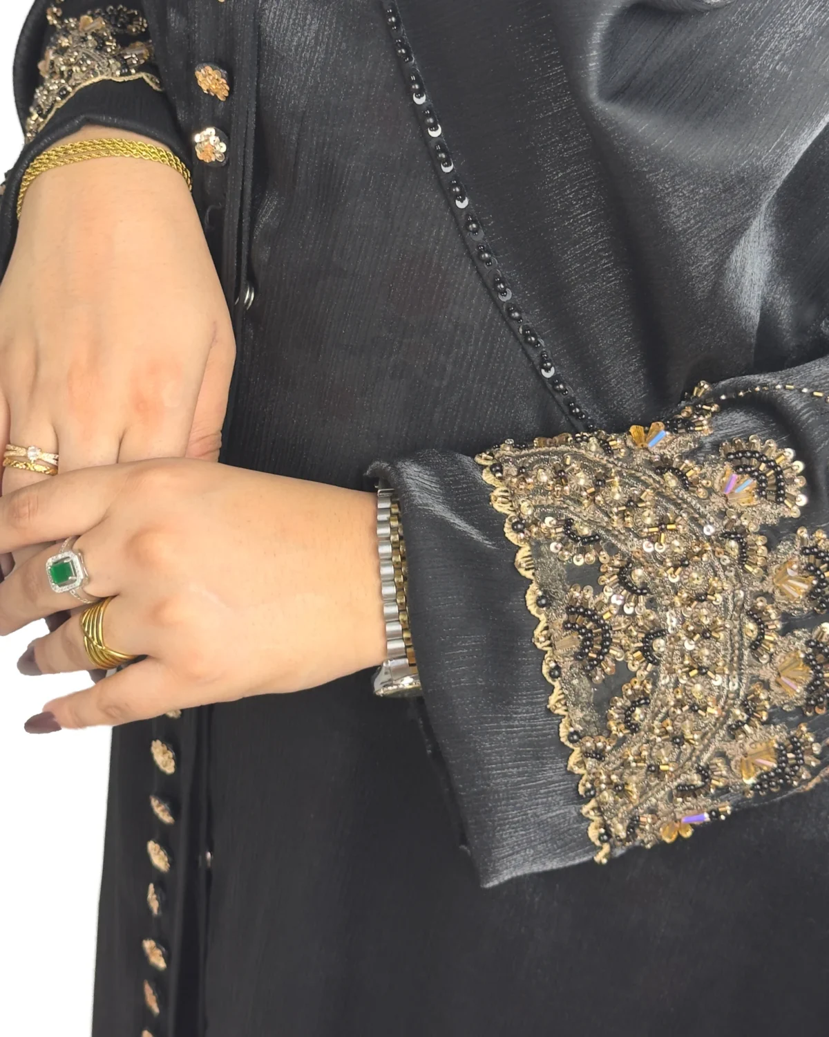 Onyx Gold black abaya close-up of the gold-and-black beaded scalloped cuff