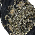 Onyx Gold black abaya close-up of the gold-and-black beaded scalloped cuff