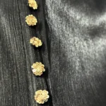 Onyx Gold black abaya close-up of the gold sequin-flower buttons