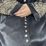 Onyx Gold black abaya close-up of the gold sequin-flower buttons