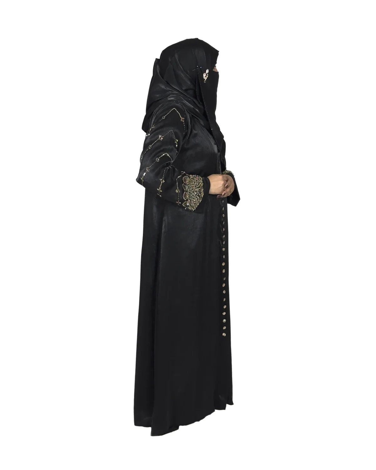 Onyx Gold black abaya side profile view with gold-and-black beaded cuffs and sequin-flower buttons