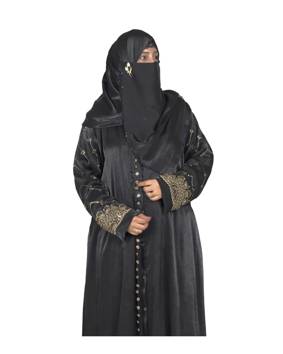 Onyx Gold black abaya front three-quarter view with gold-and-black beaded cuffs and sequin-flower buttons