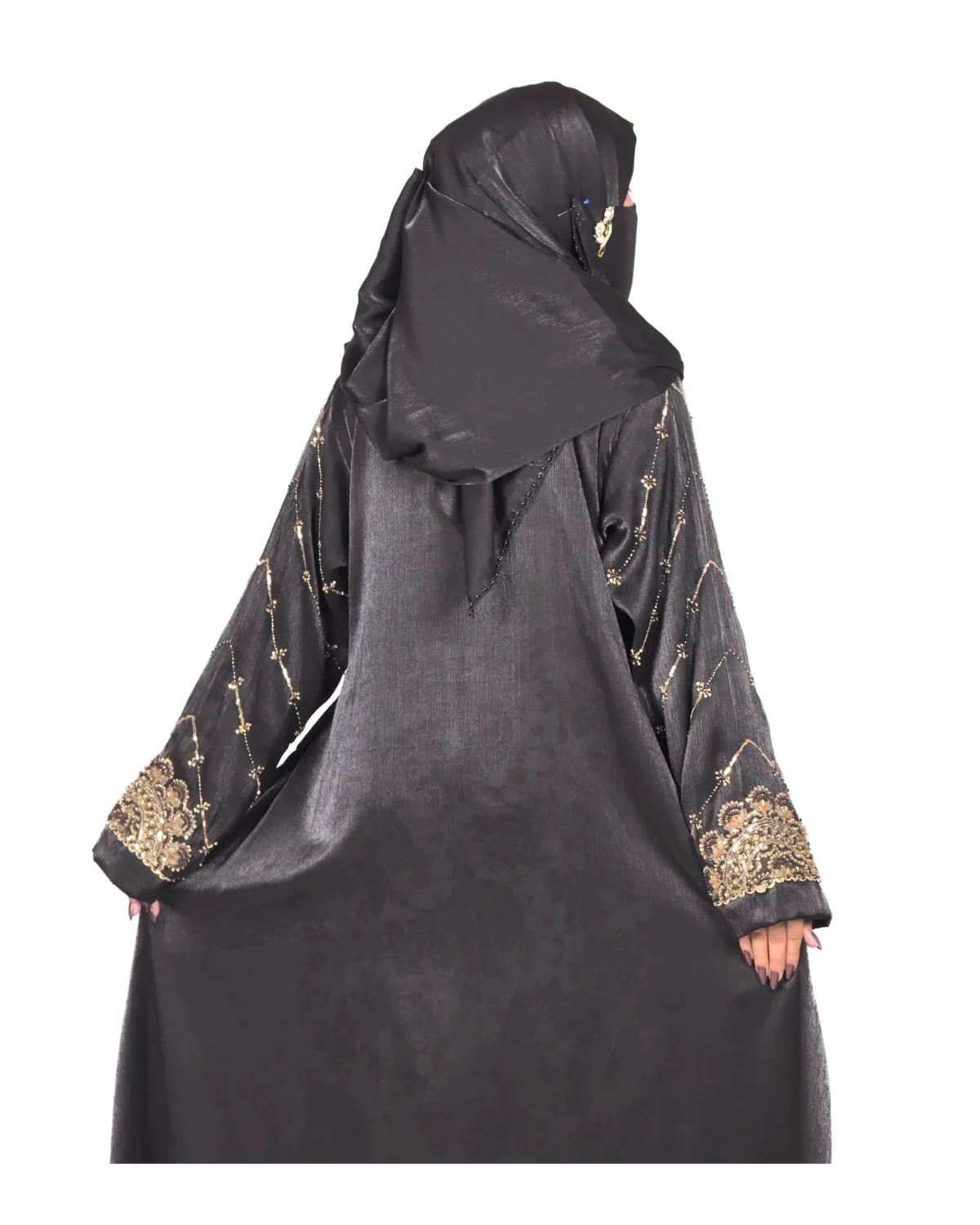 Onyx Gold black abaya front three-quarter view with gold-and-black beaded cuffs and sequin-flower buttons