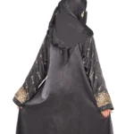 Onyx Gold black abaya front three-quarter view with gold-and-black beaded cuffs and sequin-flower buttons