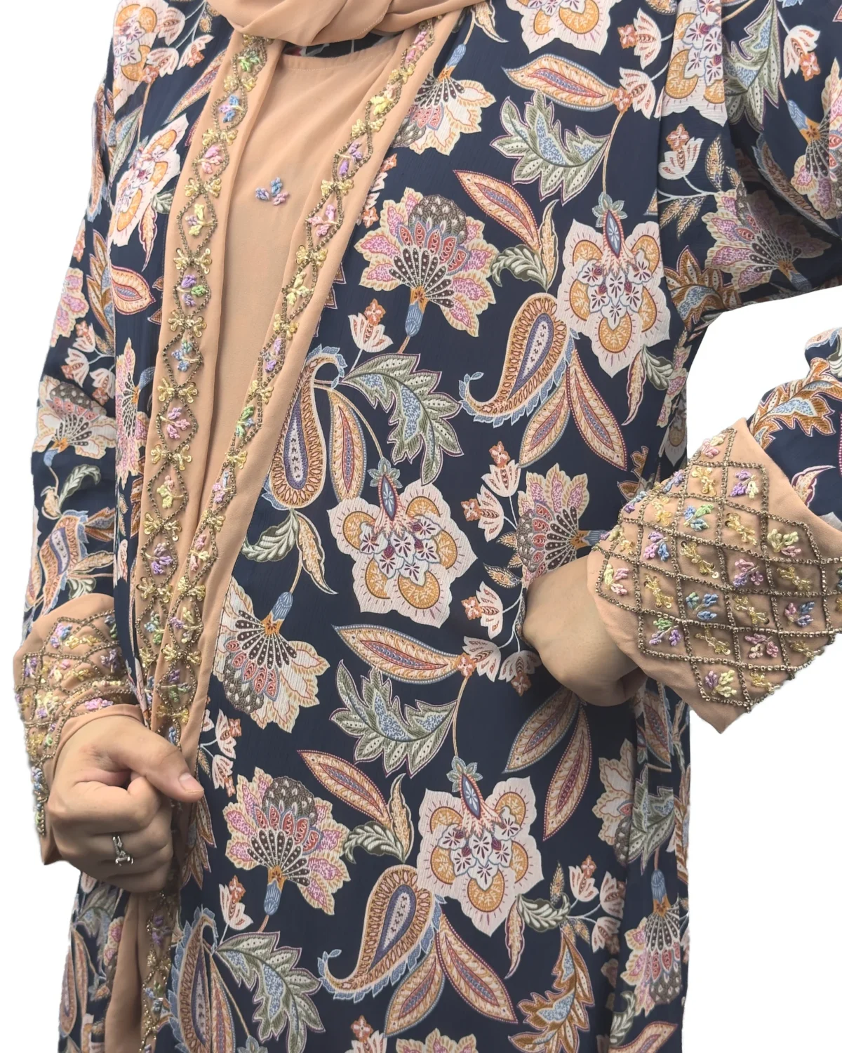 Paisley Rose navy paisley-floral print with a built-in camel inner layer abaya close-up of the diamond-lattice sequin work on the cuff