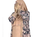 Paisley Rose navy paisley-floral print with a built-in camel inner layer abaya front three-quarter view with navy paisley print with a gold sequin border