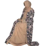 Paisley Rose navy paisley-floral print with a built-in camel inner layer abaya front three-quarter view with navy paisley print with a gold sequin border