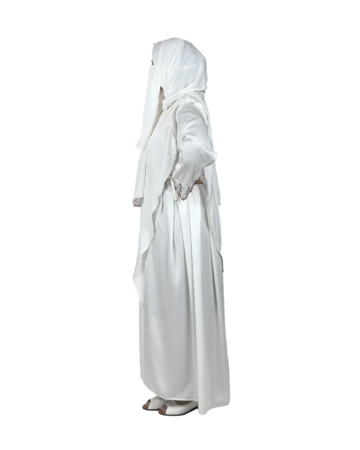 Pearl Drape white abaya side profile view with saree-style drape and multicolour beaded cuffs