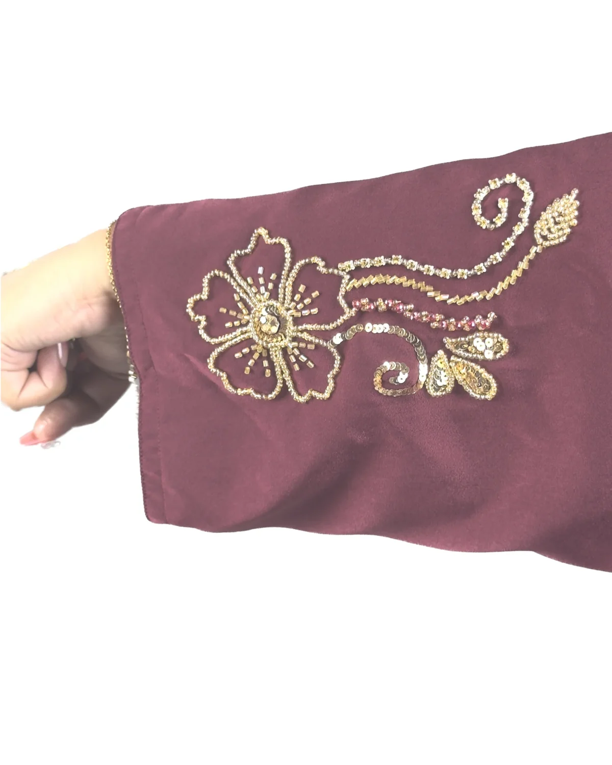 Ruby Bloom deep maroon / wine abaya close-up of the hand-beaded gold floral motif on the sleeve cuff