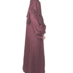 Ruby Bloom deep maroon / wine abaya side profile view with hand-beaded gold floral motifs on the cuffs and hem slits
