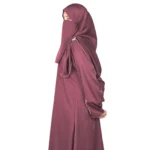 Ruby Bloom deep maroon / wine abaya side profile view with hand-beaded gold floral motifs on the cuffs and hem slits