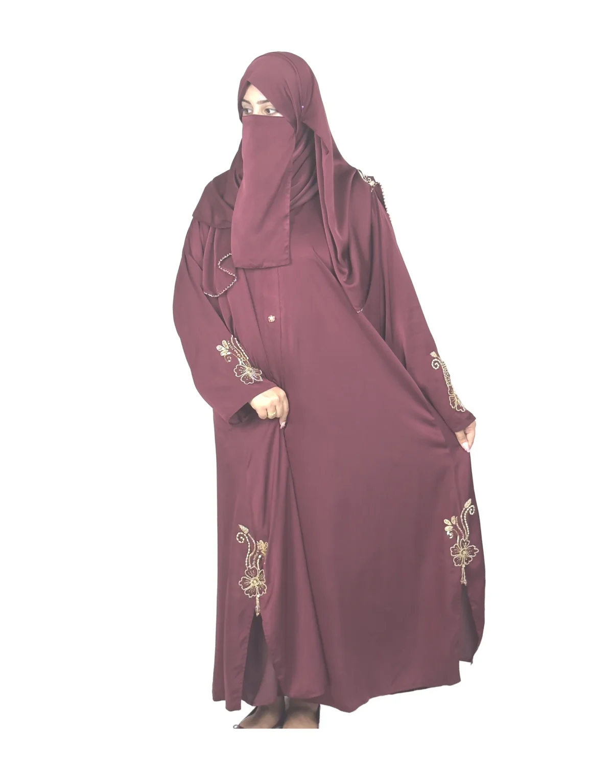 Ruby Bloom deep maroon / wine abaya front three-quarter view with hand-beaded gold floral motifs on the cuffs and hem slits