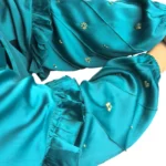 Teal Wave peacock teal abaya close-up of the ruffled tiered sleeve